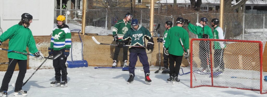 scrimmage of opposing players behind the net