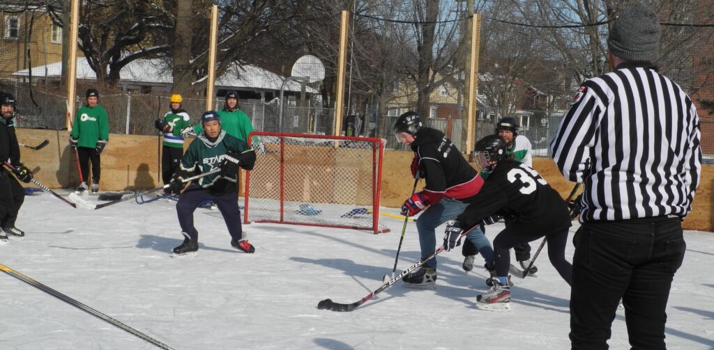 Opposing team player getting ready to shoot on empty net